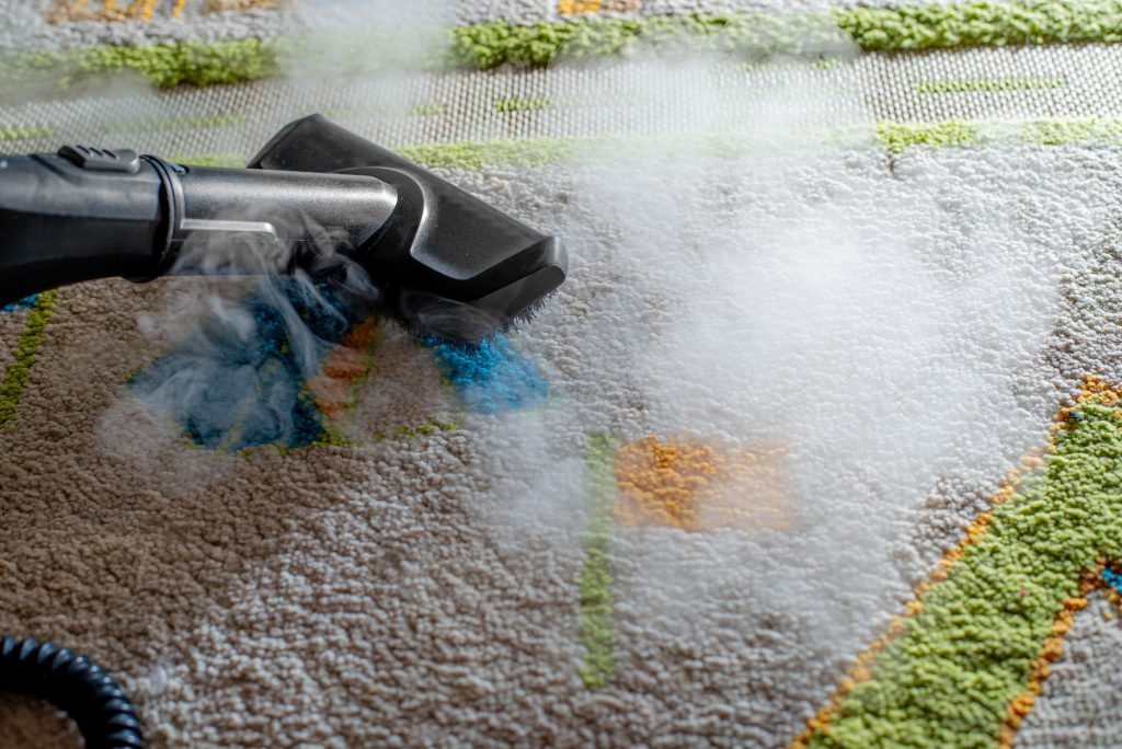 cleaning carpet in children's room with steam
